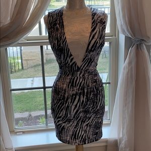 Bebe Cocktail V-neck low cut dress.